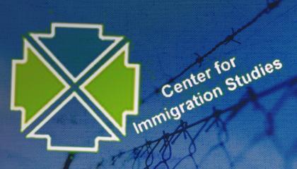 Center for Immigration Studies on a chain link fence
