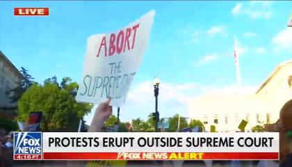 footage from Supreme Court protests; chyron: Protests erupt outside Supreme Court