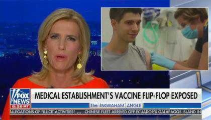 Laura, in orange dress addresses the camera; chyron reads "Medical establishment's vaccine flip flop exposed"