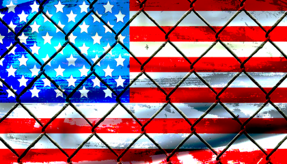 U.S. flag behind caged bars