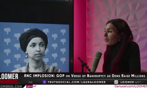 Laura Loomer speaking at an image of Rep. Ilhan Omar (D-MN)